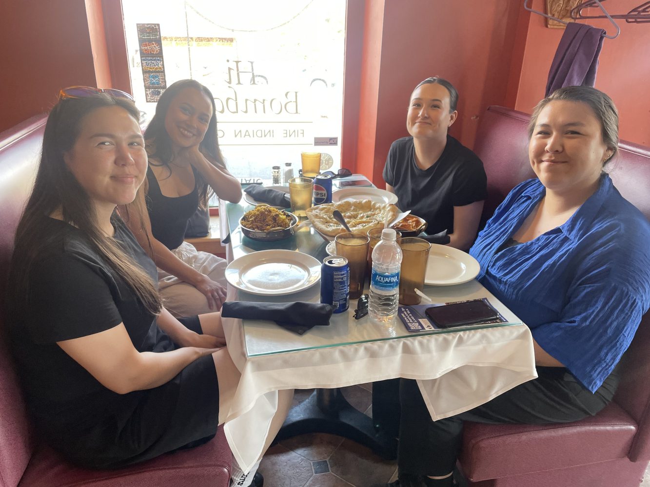 a group of people sitting at a table