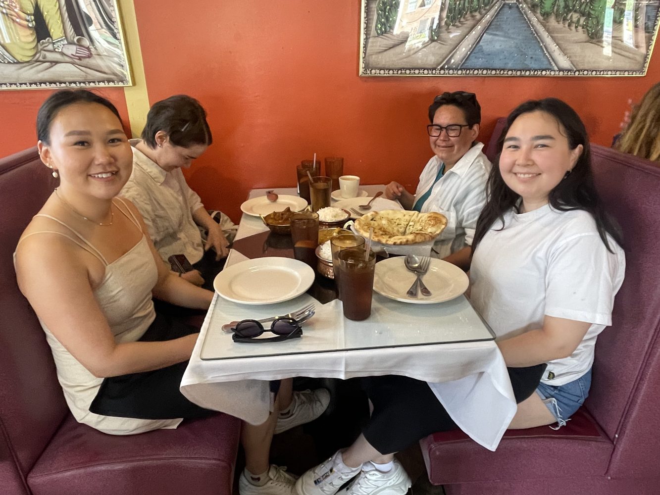 Xingtong Yao et al. sitting at a table in a restaurant