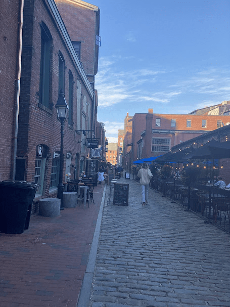 a group of people walking on a city street